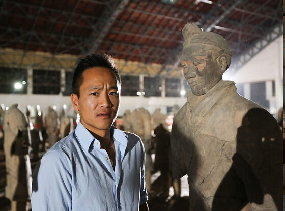 Albert Lin face to face with a terracotta warrior