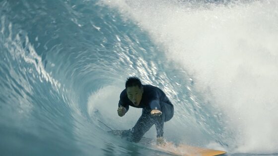 Albert Lin riding inside a barrelling wave